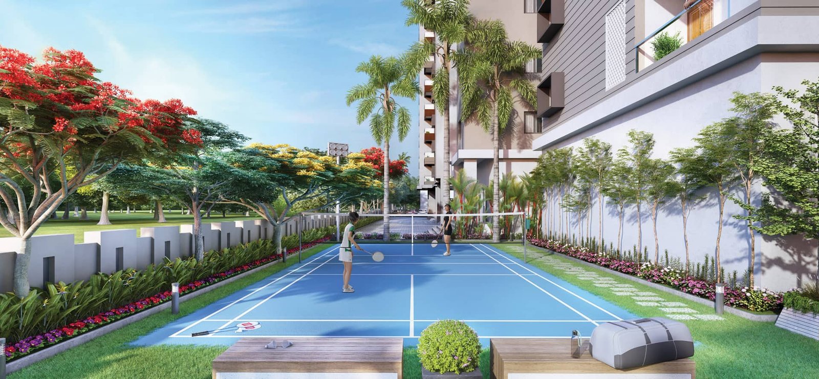 Outdoor badminton court bordered by flowering trees inside the Lal Chand Eco Heights campus