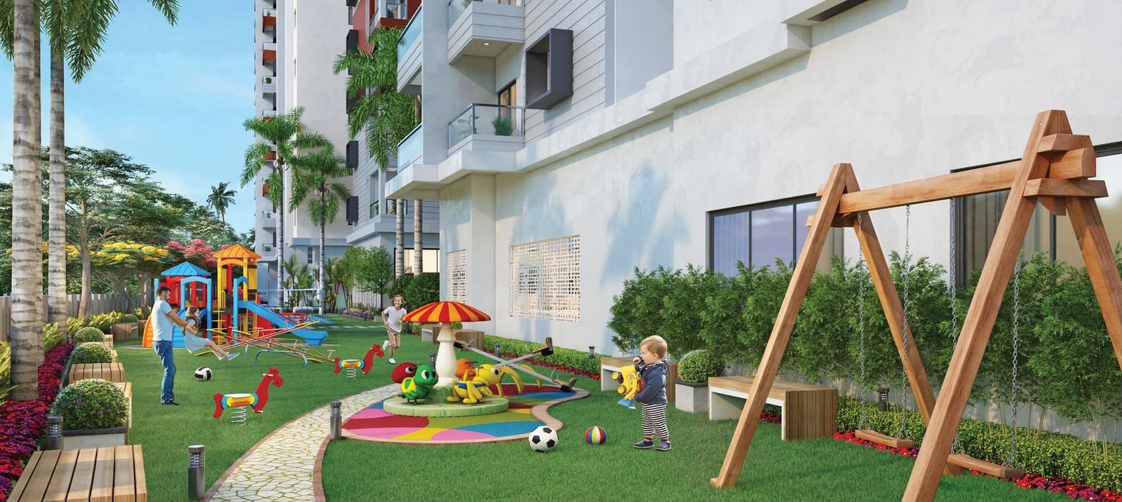 Children's play area with swings, slides and a carousel on the lawn at Lal Chand Eco Heights