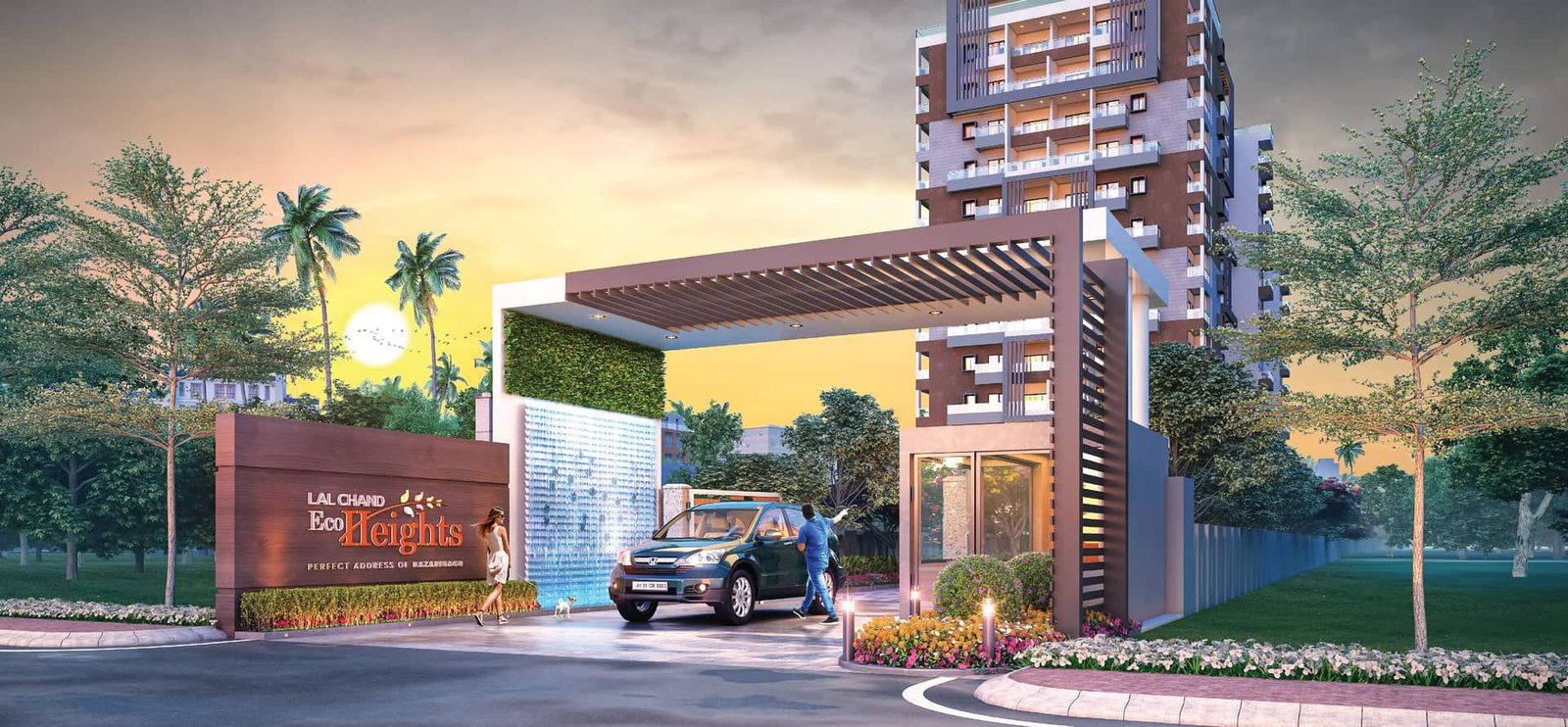 Landscaped entrance gate of Lal Chand Eco Heights apartments on NH-33, Hazaribagh, with a water feature and pergola at sunset