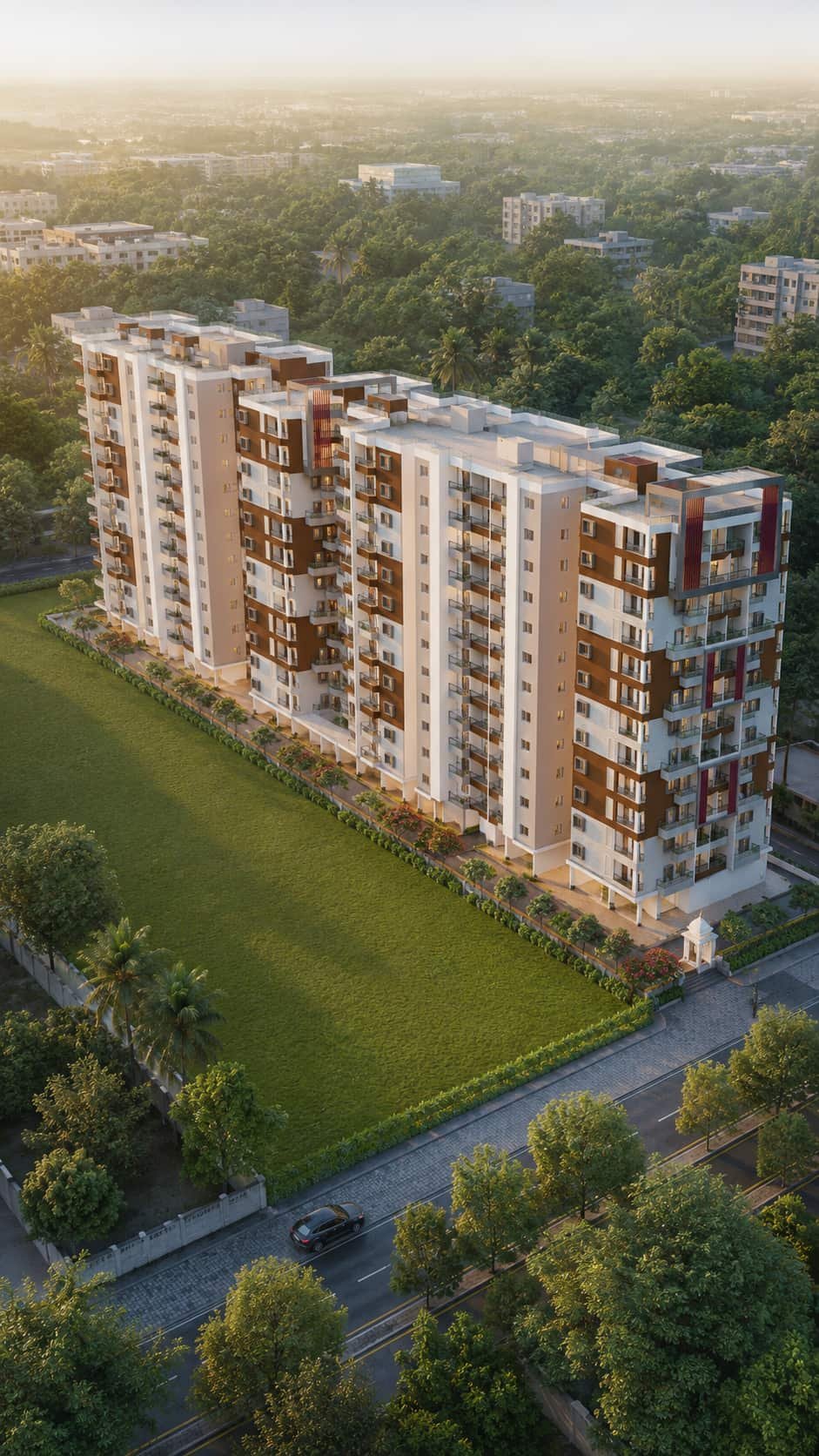 Lal Chand Eco Heights towers beside the main road at golden hour, seen from above