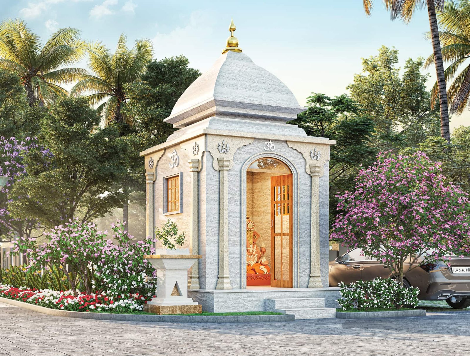 White marble temple with a Ganesh idol in the landscaped front court of Lal Chand Eco Heights