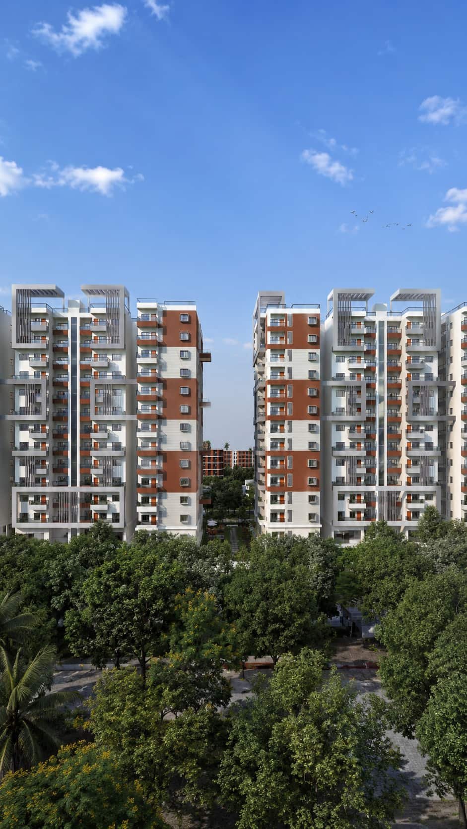 Two Lal Chand Eco Heights towers framed by a blue sky and mature trees