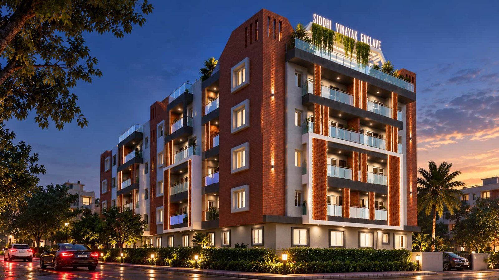 Siddhi Vinayak Enclave apartments in Hazaribagh at dusk, with a brick-clad facade, glass balconies and a rooftop garden