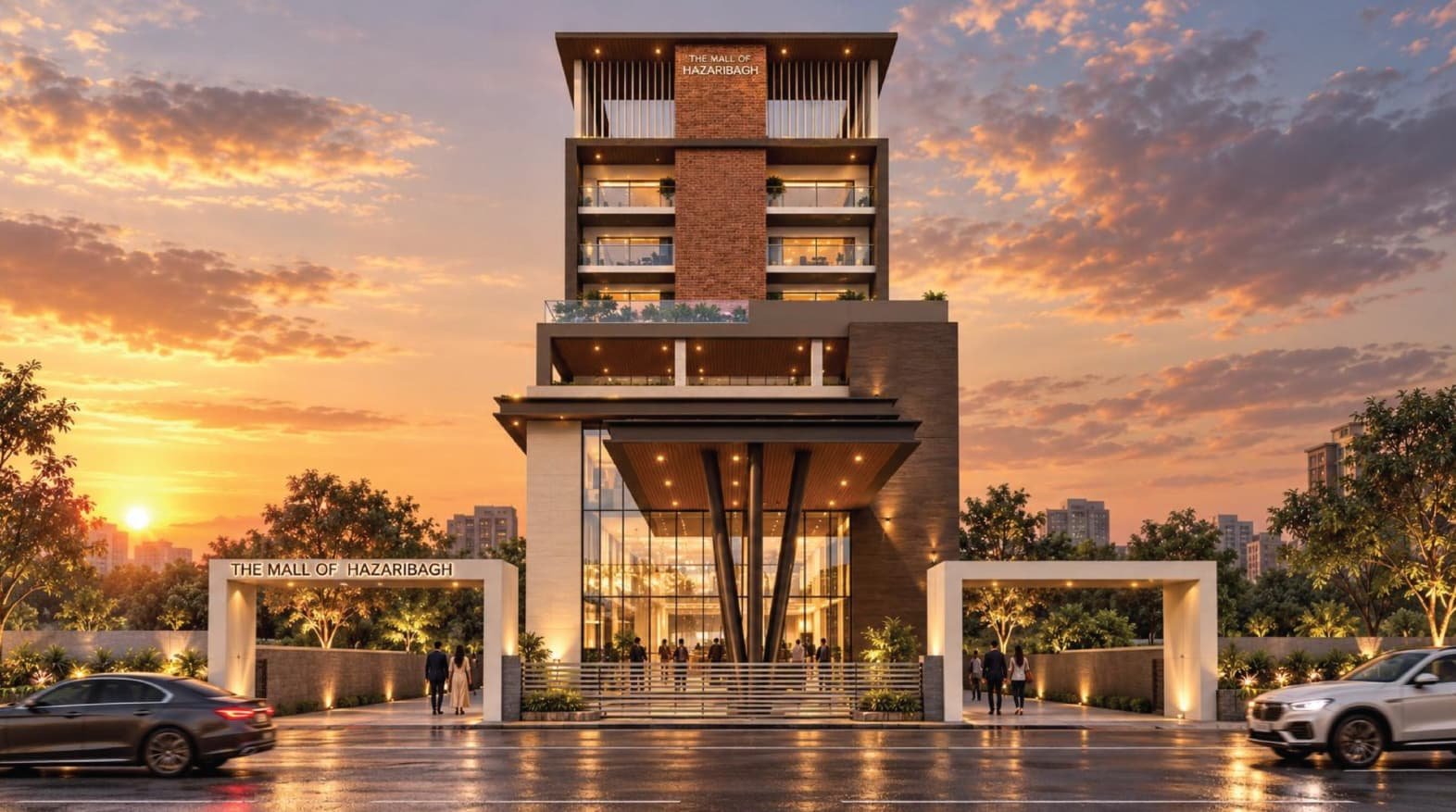 Front view of The Mall of Hazaribagh at sunset with its glazed entrance, entry arches and landscaped forecourt